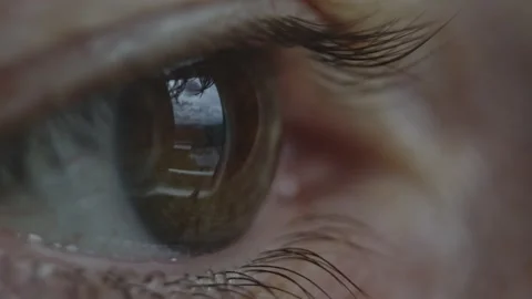 A woman's eye with a beautiful brown iris in close-up. Healthy eyesight Stock Footage 285011992