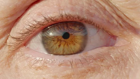Woman's eye close up opening looking at camera macro photography Stock Footage 263313976