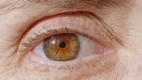 Woman's eye close up opening looking at camera macro photography Stock Footage 263325321