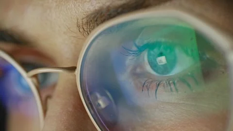 Woman's eye with glasses reflecting computer screen Stock Footage 337830382