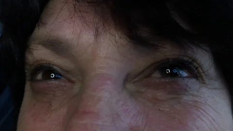 A woman's eyes look at the light Stock Footage 123689405