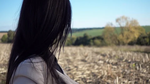 Woman's face close up in a field at sunset. Stock Footage 96988417