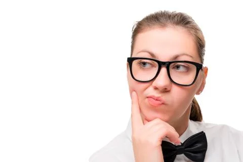 Woman's face in close-up thinking on white background Stock Photos