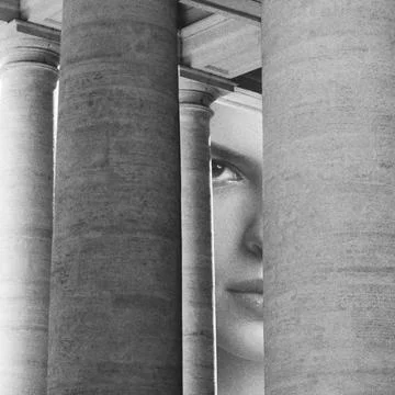 Woman's face looking through ancient columns hiding Ilustración de archivo