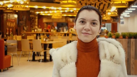 A woman's face in a mink coat. The model of European appearance is 25-30 year Stock Footage 87445804