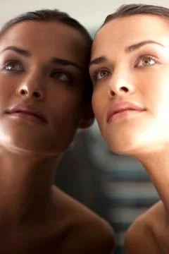 Woman's face in a mirror Stock Photos