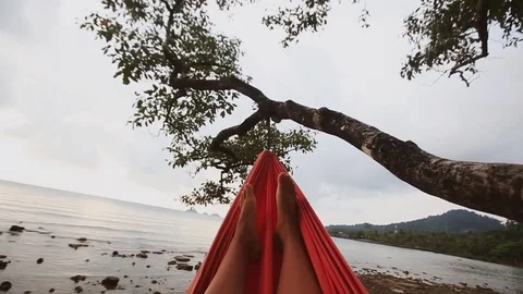 Woman's feet on the hammock Stock Footage 80355069