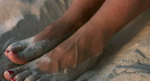 Woman's Feet in the Sand Stock Footage 61157990