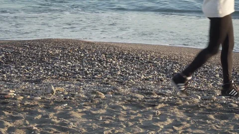 A woman's feet walking on the beach Stock Footage 82481715