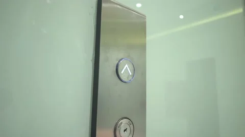 Woman's finger presses elevator lift button on elevator control panel Video stock 171668791