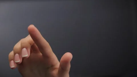 Woman's finger presses an invisible button on the glass surface Video stock 238002272
