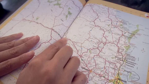 Woman's finger searching point on a map Stock-Footage 73845109
