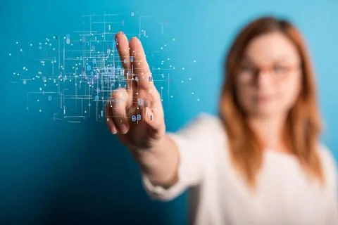 Woman's finger touching a 3D rendering of a binary code levitating in the air 写真素材
