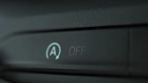 Woman's fingers activate or deactivate controls of vehicle's automatic engi.. Stock Footage 293845174
