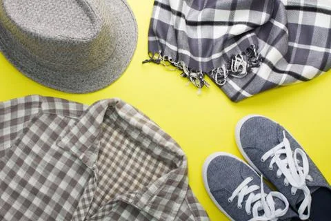 Woman's flat lay clothes gray hat sneakers scarf shirt Stock Photos