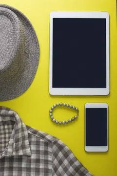 Woman's flat lay gray clothes tablet and mobile phone mockup Stock Photos