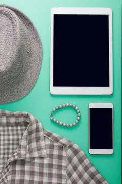 Woman's flat lay gray clothes tablet and mobile phone mockup Stock Photos