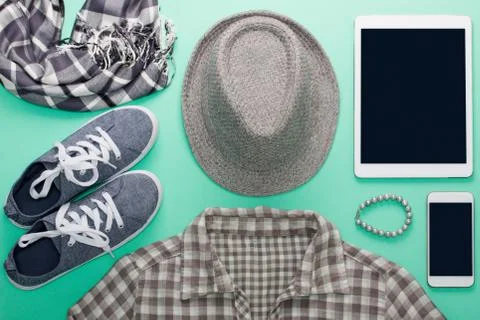 Woman's flat lay gray clothes tablet and mobile phone mockup Stock Photos