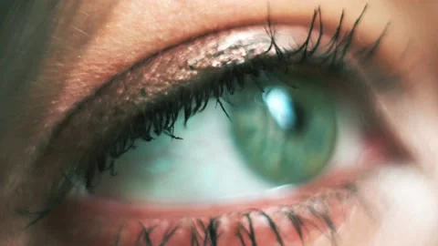 A woman's green eye with close-up makeup Stock Footage 130565486