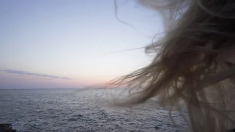 Woman's Hair Waving on Wind Looking to Sunset on the Beach Full HD Cinematic Stock Footage