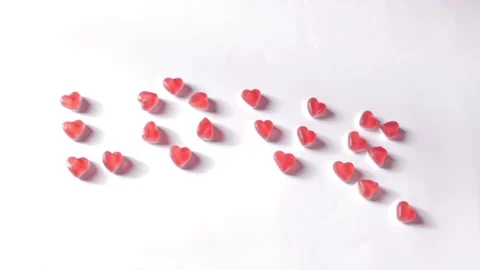 Woman's hand added a dot after the word love. Romantic message from jelly Stock Footage 231462795