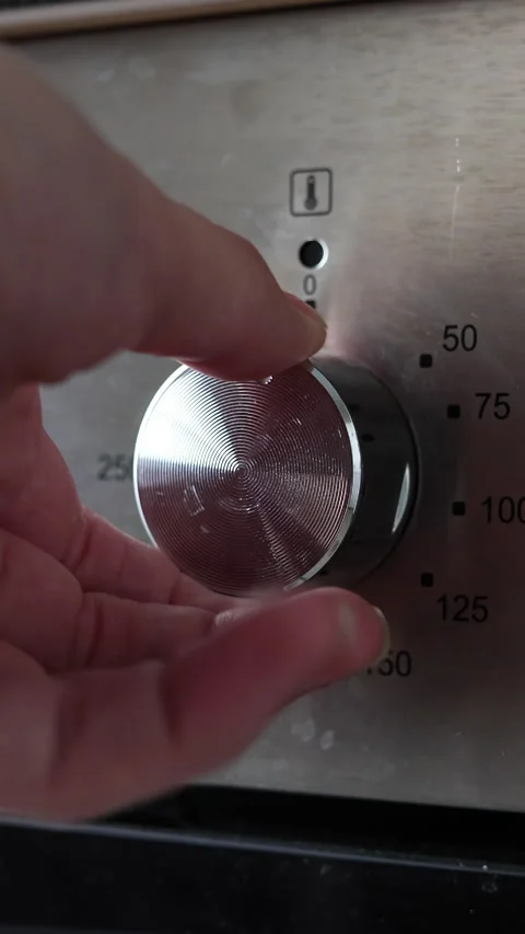 Woman's Hand Adjusting Settings On Oven. Vertical. Stock Footage 285942220