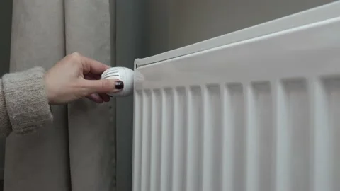 Woman's Hand Adjusting Temperature on Heating White Radiator.  Stock Footage 147241113