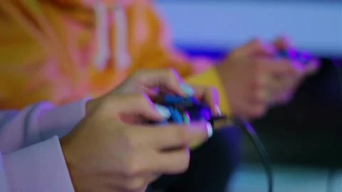 Woman's hand and console playing video games with boyfriend Stock-Footage 334653365