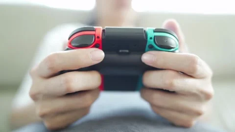 Woman's hand and console playing video games at night and pressing button Stock-Footage 334653385