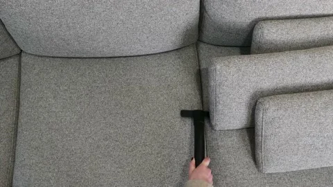 Woman's Hand are Cleaning Gap Between Sofa's Pillows. Stock Footage 147008166
