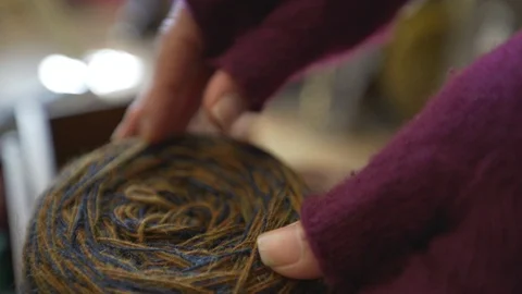 Woman's hand checking yarn Stock Footage 107574190