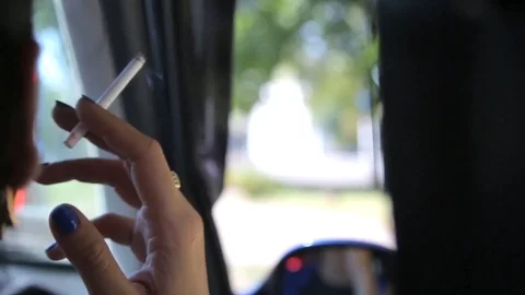 Woman's hand with a cigarette Stock Footage 86687735