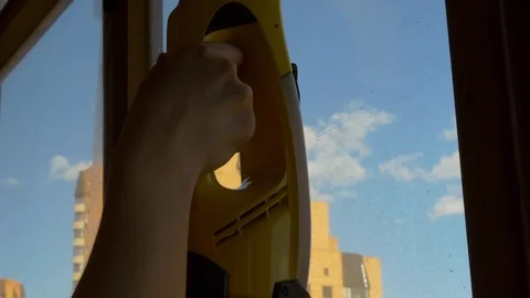 Woman's Hand Cleaning A Window On The Balcony Stock Footage