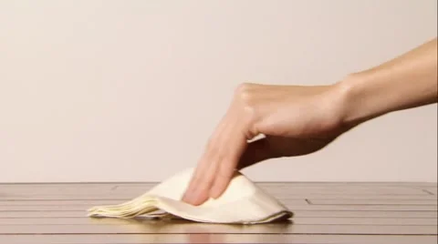 Woman's hand cleans up a spill Stock Footage