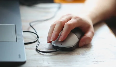 Woman's hand on computer mouse Stock Footage 58652384