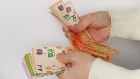 Woman's hand counting Argentine extended banknotes Stock Footage 152671773