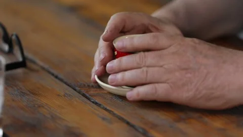 A womans hand with cup of coffee 1 Video stock 323791373