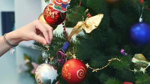 Woman's Hand Decorating Artificial Christmas Tree Indoors Stock Footage 340961452