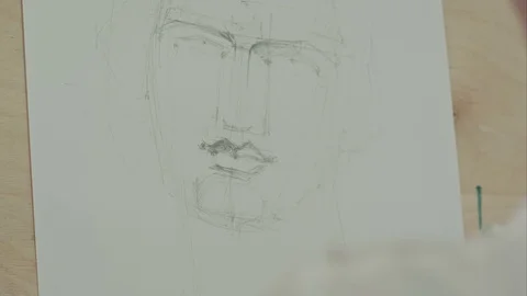 Woman's hand drawing classical man face with pencil Vídeo Stock 71410093