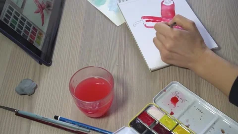 A woman's hand draws with a brush. Stock Footage 170116562