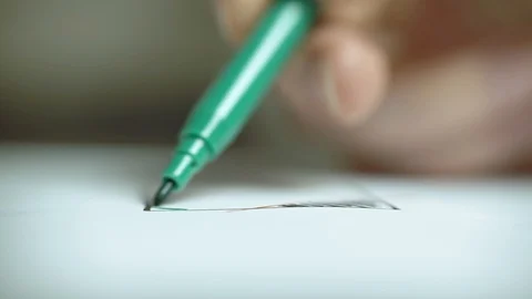 Woman's hand draws with a felt-tip pen on white paper. Close up. Stock Footage 111699471