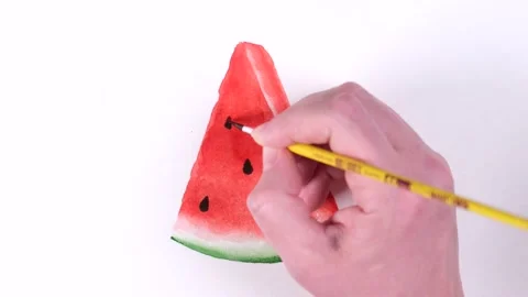 A woman's hand draws a piece of watermelon with watercolors Stock Footage 228857530