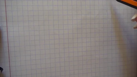 Woman's hand draws a smiley face with a pencil in a notebook Stock Footage 76213009