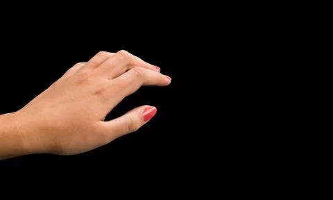 Womans hand on empty black background Stock Photos