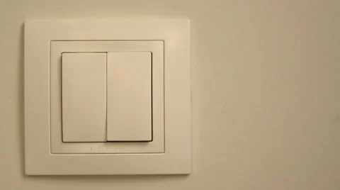 Womans hand with finger on light switch. Stock Footage 58216916