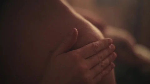 A woman's hand gently strokes a man's shoulder in the sauna. Close-up. Stock Footage 170702651