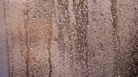 A woman's hand glides over the surface of a wet glass Stock-Footage 62727141