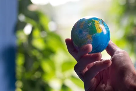 Woman's hand with globe Stock Photos
