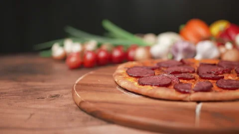 A woman's hand grabbing a slice of pepperoni pizza in slow motion in 4k. Stock Footage 137475202