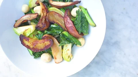 Woman's hand having salad with fork Stock Footage 76100072
